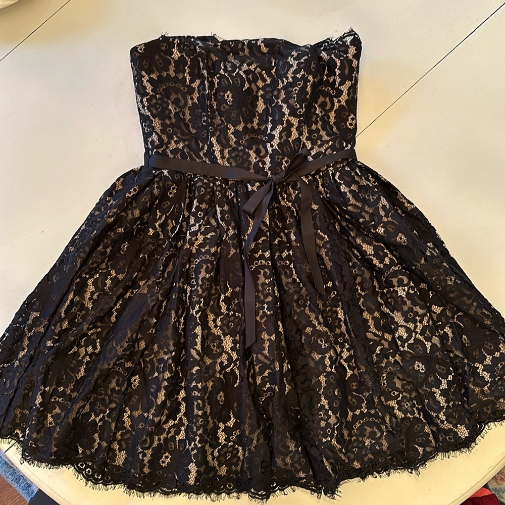 Black lace party dress. Size 4, in good condition.
